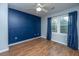 Bedroom with hardwood floors and curtains, offering a cozy and modern appeal at 106 Dunmow Dr, Summerville, SC 29485