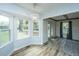 Bright dining area featuring a modern chandelier and large windows overlooking the backyard at 106 Dunmow Dr, Summerville, SC 29485