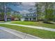 Charming two-story home with a well-manicured lawn and inviting front porch at 106 Dunmow Dr, Summerville, SC 29485
