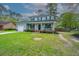Charming two-story home with a welcoming front porch and landscaped lawn at 106 Dunmow Dr, Summerville, SC 29485