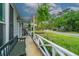 Inviting front porch featuring rocking chairs and a hanging fern at 106 Dunmow Dr, Summerville, SC 29485