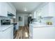 Kitchen featuring stainless steel appliances, white cabinets, and marble countertops at 106 Dunmow Dr, Summerville, SC 29485
