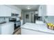 Kitchen with stainless steel appliances, white cabinets, and marble countertops at 106 Dunmow Dr, Summerville, SC 29485