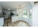 Eat-in kitchen features white cabinets, granite countertops, and stainless steel appliances at 106 Dunmow Dr, Summerville, SC 29485