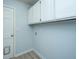 Laundry room features white cabinets for storage at 106 Dunmow Dr, Summerville, SC 29485