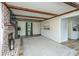 Bright living room featuring a brick fireplace, wood beams, and modern flooring at 106 Dunmow Dr, Summerville, SC 29485