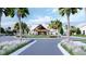 Elegant community entrance showcasing lush landscaping, sidewalks, and a grand clubhouse at 1128 Darling St, Summerville, SC 29485