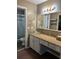 Bathroom with modern glass bowl sink, decorative mirror, and tiled shower beyond the doorway at 129 Bramwell Dr, Summerville, SC 29485