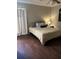Comfortable bedroom with striped bedspread, neutral walls, and natural light from side window at 129 Bramwell Dr, Summerville, SC 29485