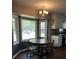Cozy dining area with a bay window providing natural light and classic round dining table with wood chairs at 129 Bramwell Dr, Summerville, SC 29485