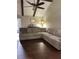 Spacious living room featuring a large sectional sofa, ceiling fan, exposed beams, and wood-look flooring at 129 Bramwell Dr, Summerville, SC 29485