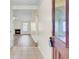 Inviting entryway leading to the living room with a fireplace, showcasing a bright and open floor plan at 1302 Camden Xing, Hanahan, SC 29410