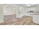 Bright kitchen featuring white cabinets, countertops, and appliances, in an open floorplan at 1302 Camden Xing, Hanahan, SC 29410
