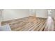 Spacious living room featuring pristine wood flooring and freshly painted walls at 1302 Camden Xing, Hanahan, SC 29410