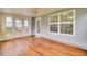 Enclosed patio with wood flooring and windows at 1302 Camden Xing, Hanahan, SC 29410