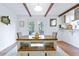 Cozy dining area with wood table, bench seating, exposed wood beams, and natural light at 1342 Dennis Blvd, Moncks Corner, SC 29461