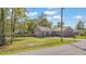Charming single-story brick home with a well-maintained lawn and mature trees at 1342 Dennis Blvd, Moncks Corner, SC 29461
