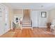 Inviting foyer with hardwood floors, staircase, and a view into other living areas at 1342 Dennis Blvd, Moncks Corner, SC 29461