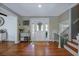 Inviting foyer with hardwood floors, white trim, and a decorative console table at 1342 Dennis Blvd, Moncks Corner, SC 29461