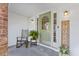 Welcoming front porch with a rocking chair, lush fern, and a decorative welcome sign at 1342 Dennis Blvd, Moncks Corner, SC 29461