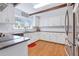 Bright and functional kitchen with white cabinets, granite countertops, and stainless steel appliances at 1342 Dennis Blvd, Moncks Corner, SC 29461