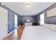 Comfortable main bedroom with hardwood floors, white walls, and natural light from many windows at 1342 Dennis Blvd, Moncks Corner, SC 29461