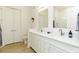 Bright bathroom featuring double sinks, quartz countertops and white cabinetry at 135 Pier View # 305, Charleston, SC 29492
