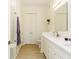 Bathroom showcasing a double vanity, white cabinets, and a glass enclosed shower at 135 Pier View # 305, Charleston, SC 29492