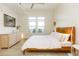 Relaxing bedroom with hardwood floors, modern furniture and plenty of sunlight at 135 Pier View # 305, Charleston, SC 29492