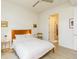 Inviting bedroom with hardwood floors, modern furniture, ceiling fan, and access to bathroom at 135 Pier View # 305, Charleston, SC 29492