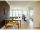 Bright dining area with hardwood floors, statement wall, modern lighting, and lots of natural light at 135 Pier View # 305, Charleston, SC 29492