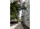 Brick apartment building with tree-lined sidewalks and street parking at 135 Pier View # 305, Charleston, SC 29492