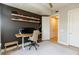 Bright home office featuring a stand-up desk, modern decor, and display shelving for collectables at 135 Pier View # 305, Charleston, SC 29492
