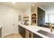 Contemporary kitchen with dark cabinets, white countertops and stainless steel sink at 135 Pier View # 305, Charleston, SC 29492