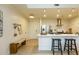 Kitchen island with stool seating and stainless steel range hood at 135 Pier View # 305, Charleston, SC 29492