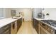 Spacious kitchen island with seating and modern stainless steel appliances at 135 Pier View # 305, Charleston, SC 29492