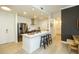 Modern kitchen with stainless steel appliances, island, and dark wall accents at 135 Pier View # 305, Charleston, SC 29492