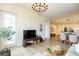 Comfortable living room with hardwood floors, modern lighting, and bright and airy atmosphere at 135 Pier View # 305, Charleston, SC 29492