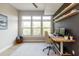 Office space with large windows, bright lighting, and custom shelving at 135 Pier View # 305, Charleston, SC 29492