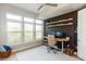 Office space with large windows, bright lighting, and custom shelving at 135 Pier View # 305, Charleston, SC 29492