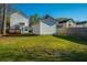 Spacious backyard with a lush lawn and partial fencing at 137 St Phillips Row, Summerville, SC 29485
