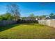 Large fenced backyard featuring green grass and mature trees at 137 St Phillips Row, Summerville, SC 29485