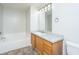 Bathroom featuring a vanity with sink, a large mirror, and a tub at 137 St Phillips Row, Summerville, SC 29485