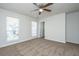 Bedroom featuring plush carpet, a ceiling fan, and two large windows at 137 St Phillips Row, Summerville, SC 29485
