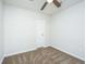 This carpeted bedroom has a lighted ceiling fan, and a full-size door with white trim at 137 St Phillips Row, Summerville, SC 29485