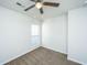 Bright bedroom with a window, lighted ceiling fan, and neutral carpet flooring at 137 St Phillips Row, Summerville, SC 29485