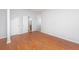 Clean, vacant bedroom with hardwood floors, neutral walls, and a view into the bathroom at 137 St Phillips Row, Summerville, SC 29485