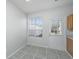 Bright dining area with natural light and a view of the backyard through a window and door at 137 St Phillips Row, Summerville, SC 29485