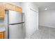 Kitchen area featuring a stainless steel refrigerator and closet space with tile flooring at 137 St Phillips Row, Summerville, SC 29485