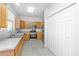 Kitchen with stainless steel appliances, wood cabinets, and closet space at 137 St Phillips Row, Summerville, SC 29485